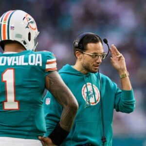Miami Dolphins head coach Mike McDaniel talks to quarterback Tua Tagovailoa (1) against the Dallas Cowboys during the second quarter at Hard Rock Stadium.