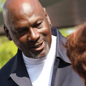 Michael Jordan takes the time to pose for a few photos and greet spectators and friends outside of The Michael Jordan Family Medical Clinic led by Novant Health. A ribbon cutting ceremony for the new clinic opening off of Greenfield Street Tuesday May 7, 2024