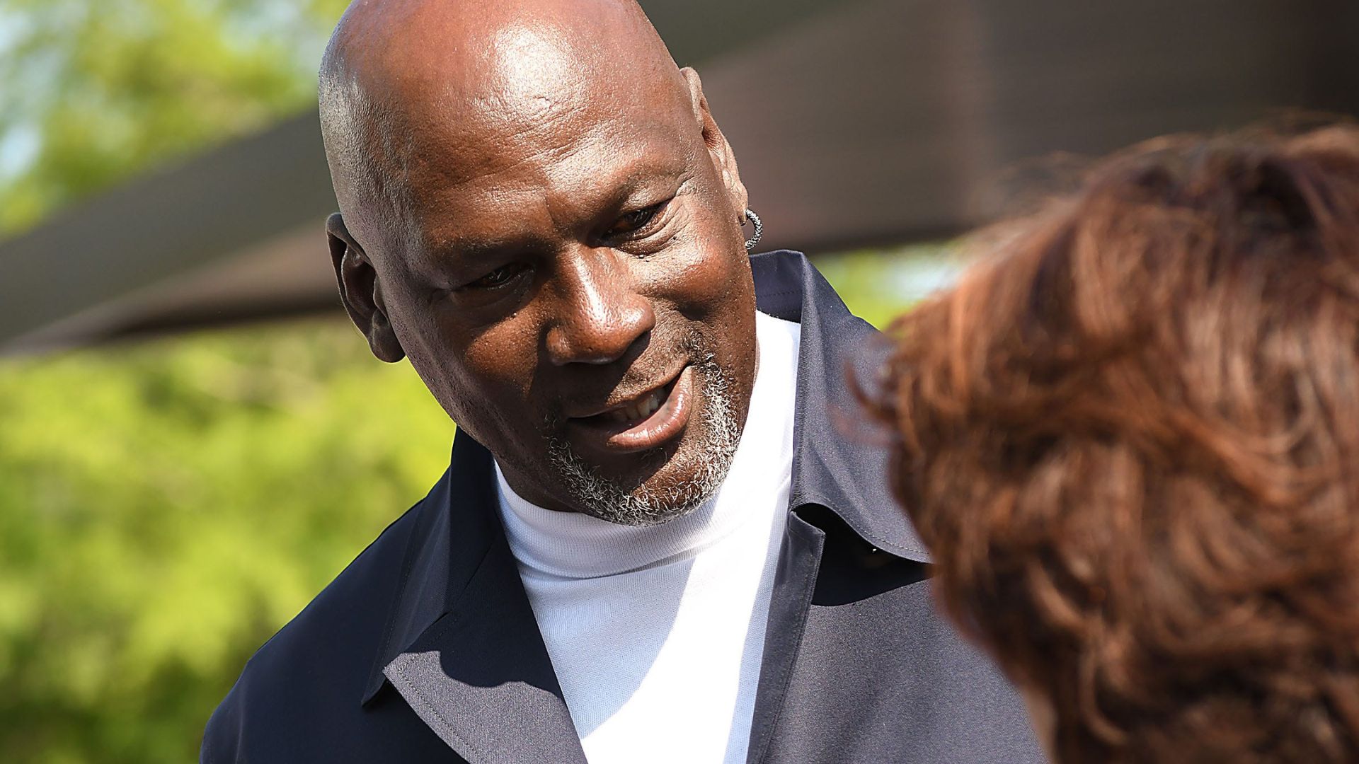 Michael Jordan takes the time to pose for a few photos and greet spectators and friends outside of The Michael Jordan Family Medical Clinic led by Novant Health. A ribbon cutting ceremony for the new clinic opening off of Greenfield Street Tuesday May 7, 2024