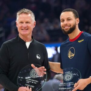 Golden State Warriors head coach Steve Kerr and guard Stephen Curry (30) are recognized as the USA Basketball head coach and male athlete of the year before the start of the game against the Oklahoma City Thunder at the Chase Center.