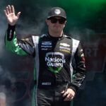 Jul 13, 2025; Sonoma, California, USA; NASCAR Cup Series driver Justin Haley (7) waves after being introduced to fans before the start of the NASCAR Toyota / Save Mart 360 at Sonoma Raceway