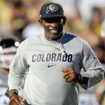 Colorado Buffaloes head coach Deion Sanders reacts before the game against the Brigham Young Cougars at Folsom Field.