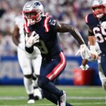 New England Patriots wide receiver Stefon Diggs (8) makes a catch against the Buffalo Bills during the second half at Highmark Stadium.