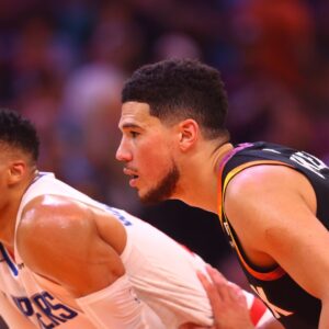 Apr 18, 2023; Phoenix, Arizona, USA; Los Angeles Clippers guard Russell Westbrook (0) against Phoenix Suns guard Devin Booker (1) during game two of the 2023 NBA playoffs at Footprint Center.