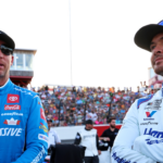 May 18, 2025; North Wilkesboro, North Carolina, USA; NASCAR Cup Series driver Kyle Larson (5) and NASCAR Cup Series driver Denny Hamlin (11) before the NASCAR All-Star Open at North Wilkesboro Speedway. Mandatory Credit: Peter Casey-Imagn Images