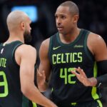 Boston Celtics center Al Horford (42) talks to guard Derrick White (9) during the first half against the Toronto Raptors at Scotiabank Arena