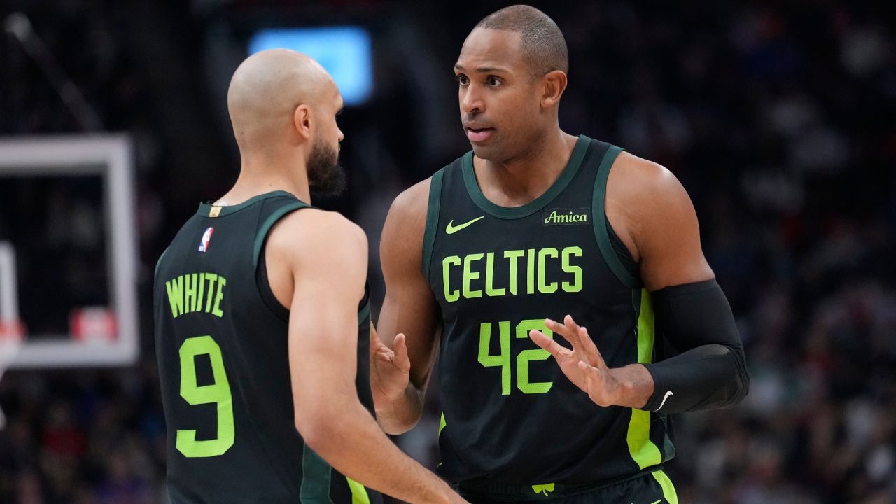 Boston Celtics center Al Horford (42) talks to guard Derrick White (9) during the first half against the Toronto Raptors at Scotiabank Arena