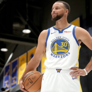 Sep 29, 2025; San Francisco, CA, USA; Golden State Warriors guard Stephen Curry (30) holds onto the ball during Media Day at the Chase Center
