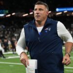 New England Patriots head coach Mike Vrabel runs off the field following a game against the New Orleans Saints at Caesars Superdome.