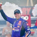 Oct 12, 2025; Las Vegas, Nevada, USA; NASCAR Cup Series driver Denny Hamlin (11) celebrates his victory following the South Point 400 at Las Vegas Motor Speedway.