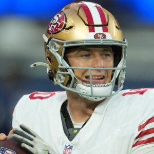 San Francisco 49ers quarterback Mac Jones (10) drops back to pass against the Los Angeles Rams during the first half at SoFi Stadium.