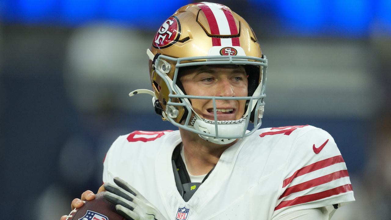 San Francisco 49ers quarterback Mac Jones (10) drops back to pass against the Los Angeles Rams during the first half at SoFi Stadium.