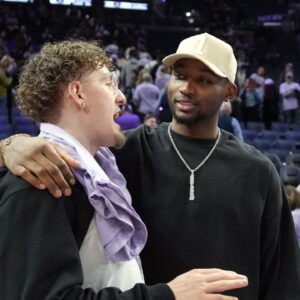May 16, 2025; San Francisco, California, USA; Golden State Warriors guard Brandin Podziemski (left) and Jonathan Kuminga (right) talk after the game between the Golden State Valkyries and the Los Angeles Sparks at Chase Center. Mandatory Credit: Darren Yamashita-Imagn Images