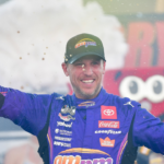Oct 12, 2025; Las Vegas, Nevada, USA; NASCAR Cup Series driver Denny Hamlin (11) celebrates his victory following the South Point 400 at Las Vegas Motor Speedway. Mandatory Credit: Gary A. Vasquez-Imagn Images