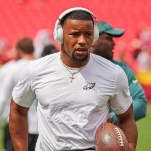Philadelphia Eagles running back Saquon Barkley (26) warms up against the Kansas City Chiefs prior to a game at GEHA Field at Arrowhead Stadium.