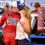NASCAR Truck Series driver Ryan Preece kisses his wife Heather DesRochers after winning the Rackley Roofing 200 NASCAR Camping World Truck Series race at the Nashville Superspeedway in Lebanon, Tenn.,