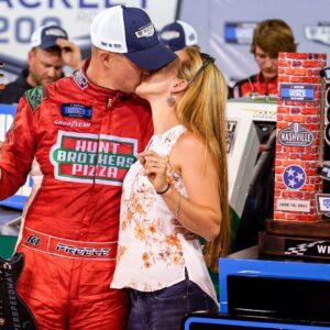 NASCAR Truck Series driver Ryan Preece kisses his wife Heather DesRochers after winning the Rackley Roofing 200 NASCAR Camping World Truck Series race at the Nashville Superspeedway in Lebanon, Tenn.,