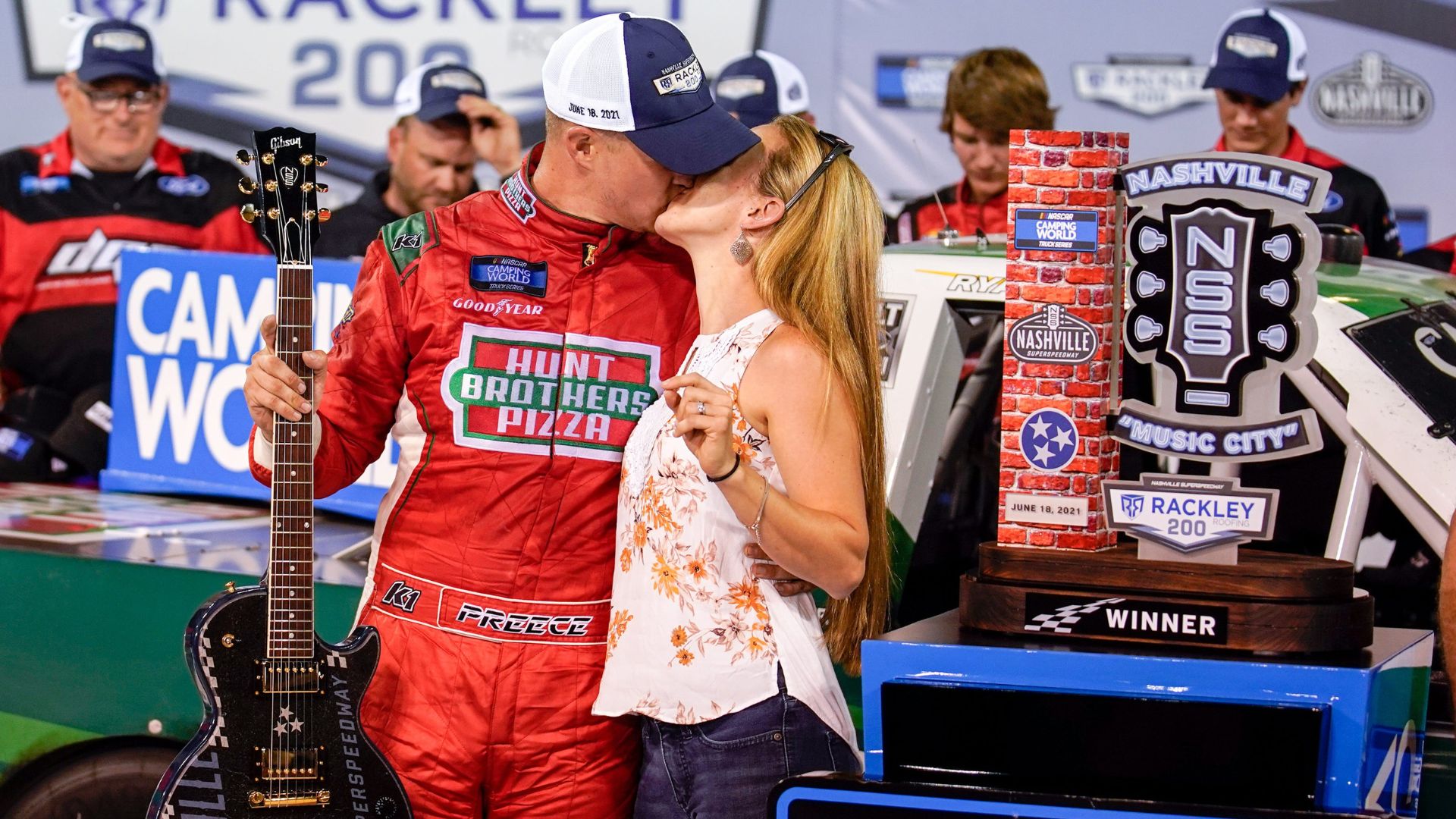 NASCAR Truck Series driver Ryan Preece kisses his wife Heather DesRochers after winning the Rackley Roofing 200 NASCAR Camping World Truck Series race at the Nashville Superspeedway in Lebanon, Tenn.,