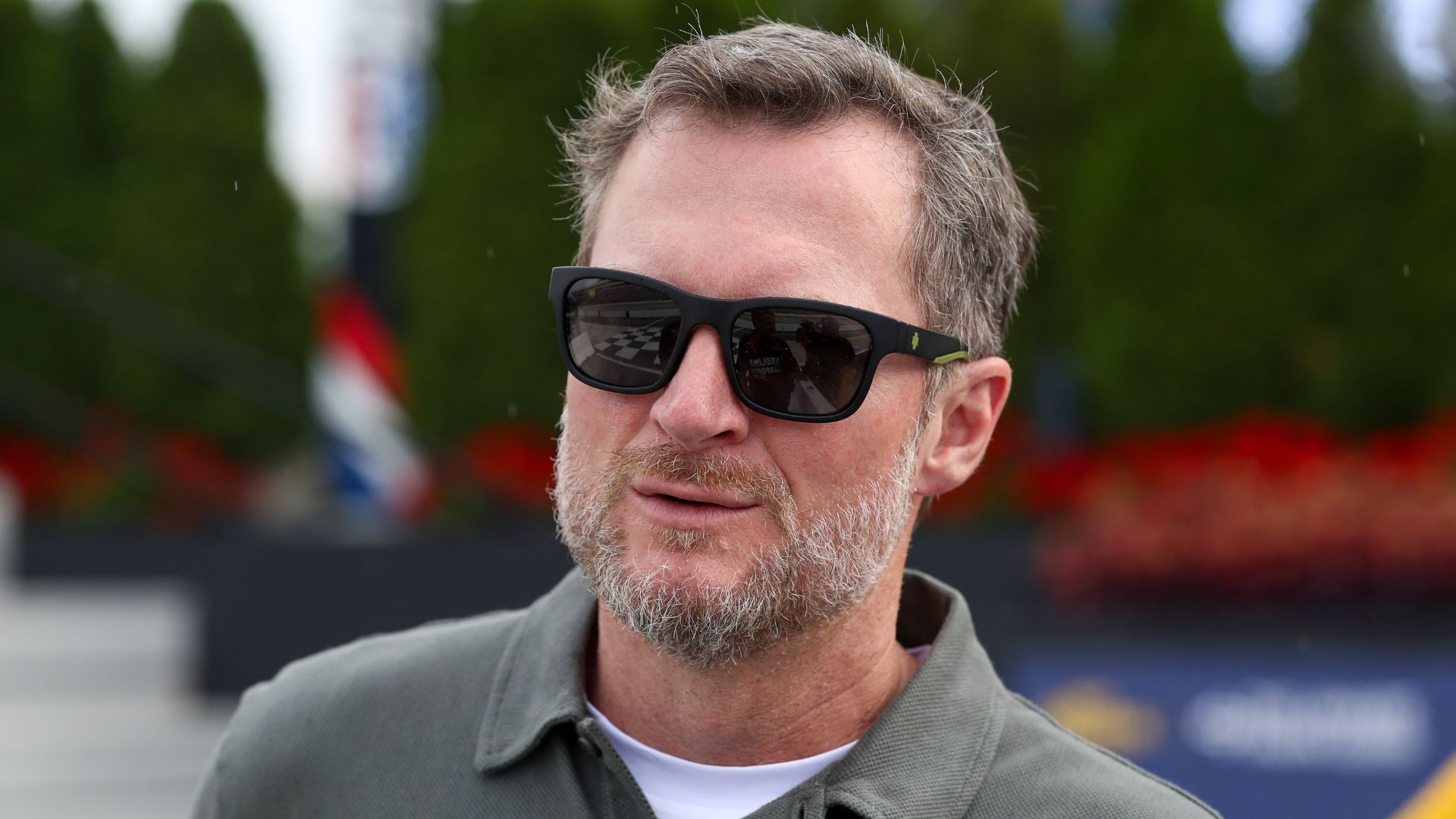 Jul 19, 2025; Dover, Delaware, USA; NASCAR Xfinity Series owner Dale Earnhardt Jr. looks on from pit road during the BetRivers 200 at Dover Motor Speedway