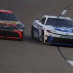 Aug 16, 2025; Richmond, Virginia, USA; NASCAR Cup Series driver Chase Briscoe (19) races NASCAR Cup Series driver Ty Gibbs (54) during the NASCAR Cup Series Cook Out 400 at Richmond Raceway