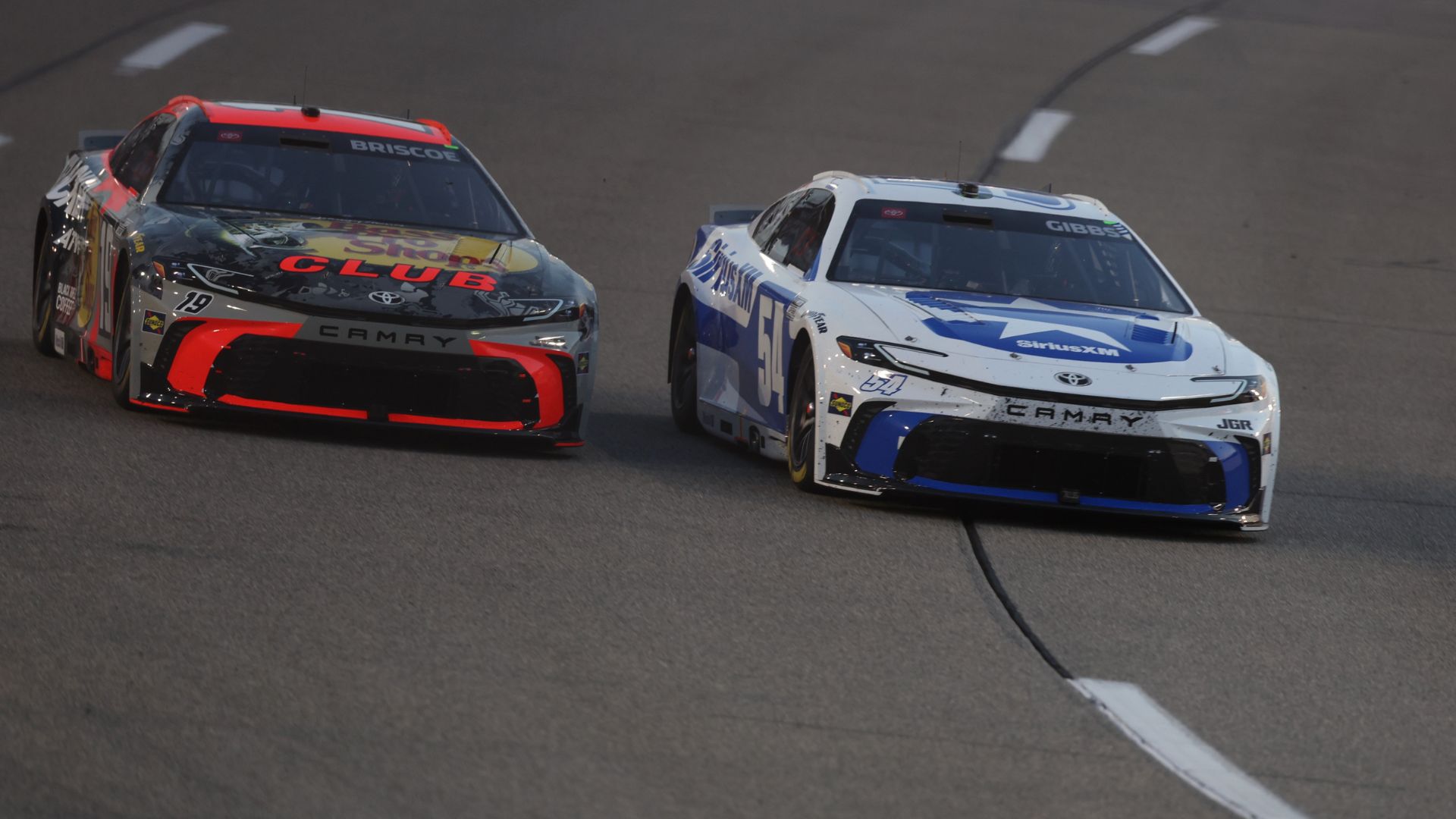 Aug 16, 2025; Richmond, Virginia, USA; NASCAR Cup Series driver Chase Briscoe (19) races NASCAR Cup Series driver Ty Gibbs (54) during the NASCAR Cup Series Cook Out 400 at Richmond Raceway