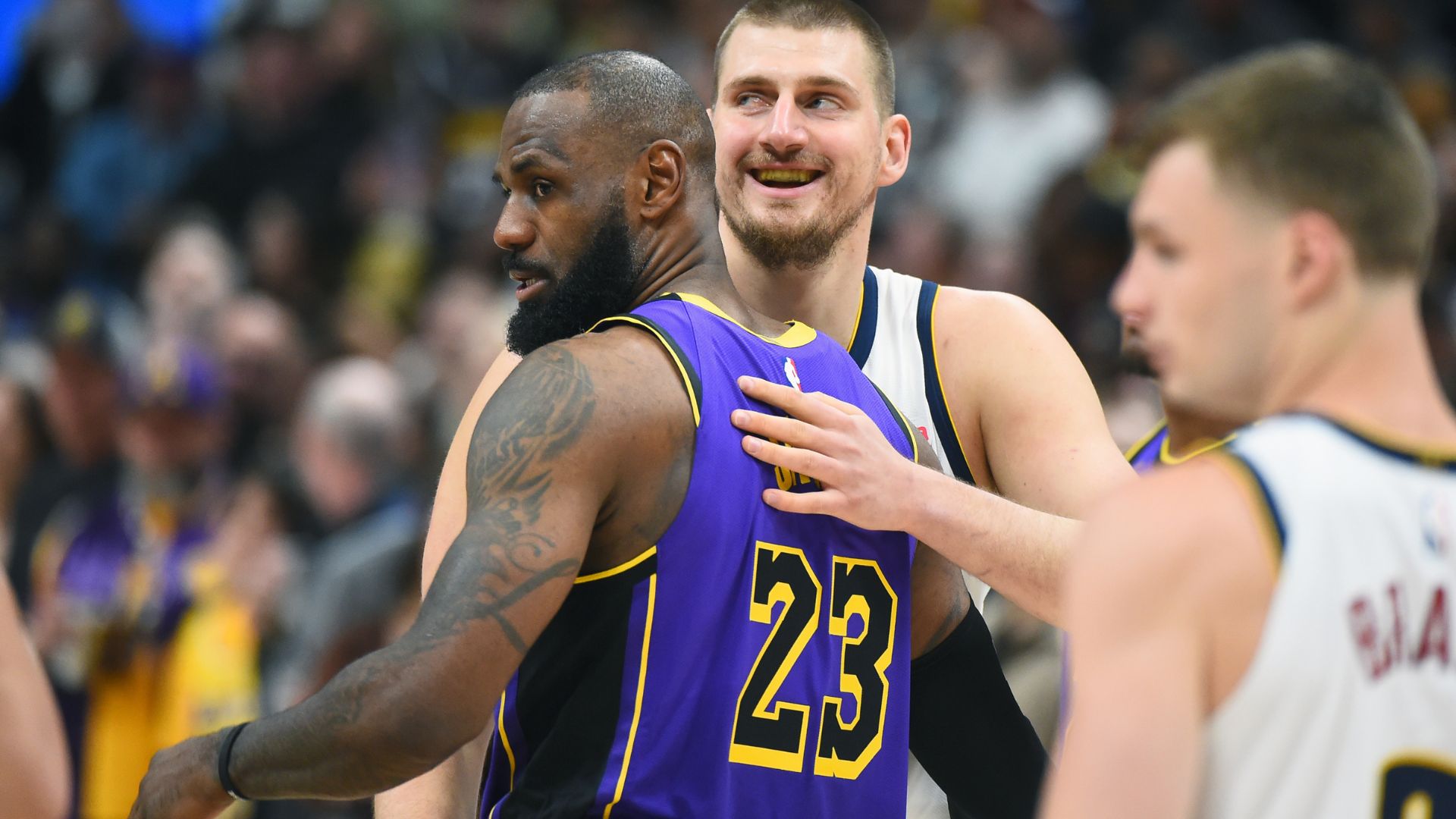 Feb 22, 2025; Denver, Colorado, USA; Denver Nuggets center Nikola Jokic (15) and Los Angeles Lakers forward LeBron James (23) hug before the game at Ball Arena
