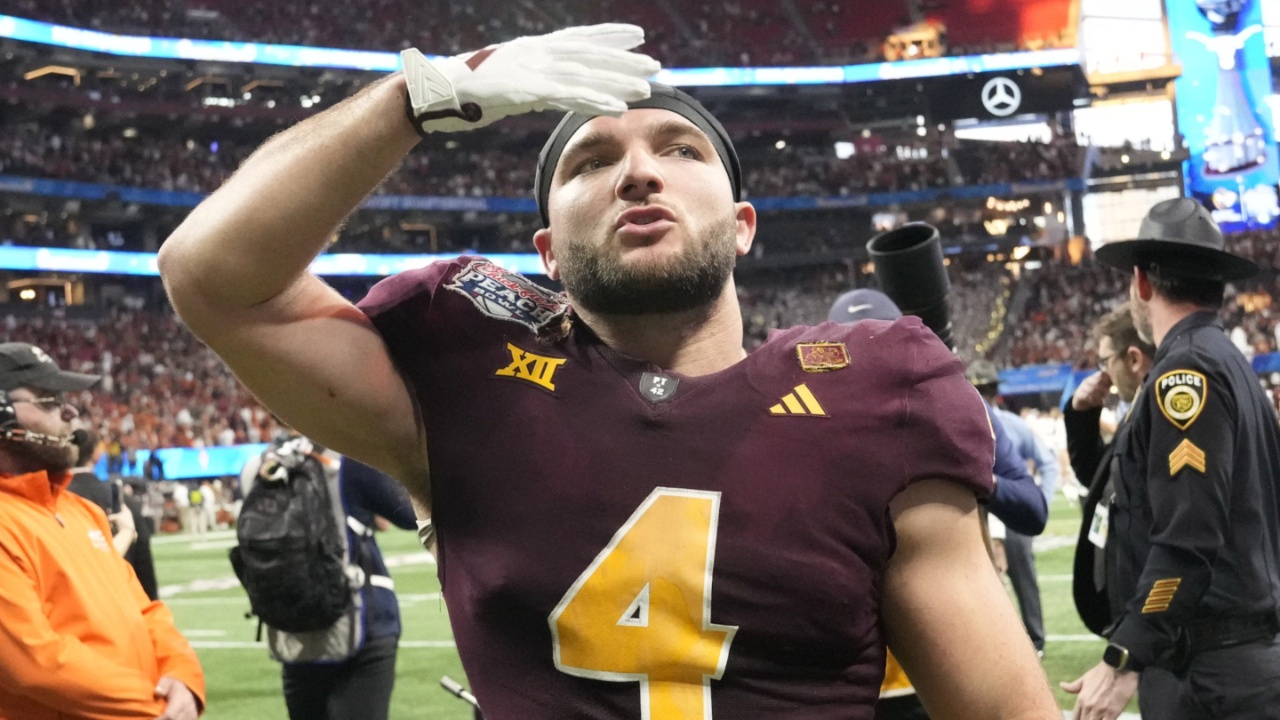 Arizona State running back Cam Skattebo (4) blows a kiss toward fans after Texas won 39-31 in double overtime in the Chick-fil-A Peach Bowl in Atlanta on Jan. 1, 2025.