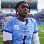 Tennessee Titans quarterback Cam Ward (1) heads to the locker room after the game against the New England Patriots at Nissan Stadium in Nashville, Tenn., Sunday, Oct. 19, 2025.