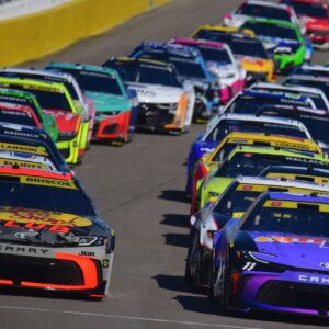Oct 12, 2025; Las Vegas, Nevada, USA; NASCAR Cup Series driver Chase Briscoe (19) and driver Denny Hamlin (11) lead the field for the start of the South Point 400 at Las Vegas Motor Speedway.