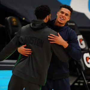 Apr 11, 2021; Denver, Colorado, USA; Boston Celtics forward Jayson Tatum (0) greets Denver Nuggets forward Michael Porter Jr. (1) before the game at Ball Arena