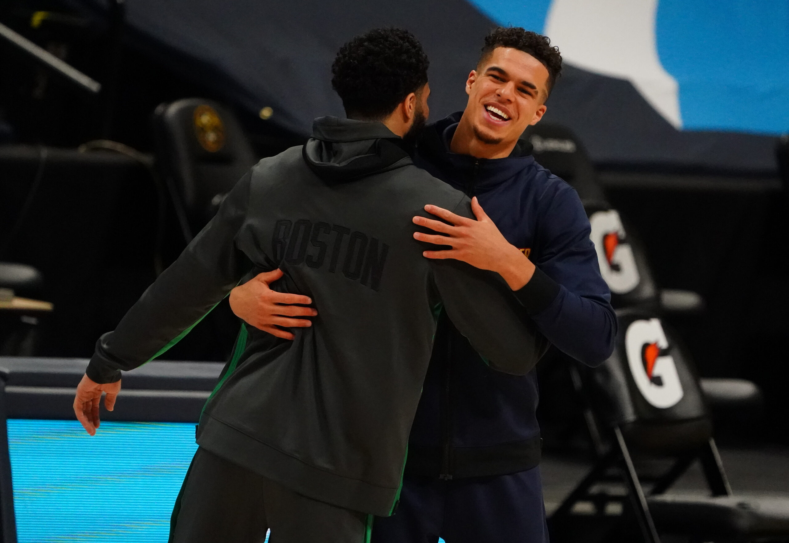 Apr 11, 2021; Denver, Colorado, USA; Boston Celtics forward Jayson Tatum (0) greets Denver Nuggets forward Michael Porter Jr. (1) before the game at Ball Arena