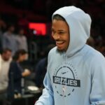Oct 17, 2025; Miami, Florida, USA; Memphis Grizzlies guard Ja Morant (12) who did not play due to injury, leaves the court after the Memphis Grizzlies defeat the Miami Heat at Kaseya Center. Mandatory Credit: Jim Rassol-Imagn Images