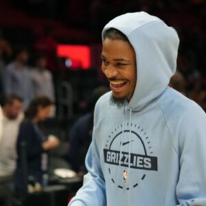 Oct 17, 2025; Miami, Florida, USA; Memphis Grizzlies guard Ja Morant (12) who did not play due to injury, leaves the court after the Memphis Grizzlies defeat the Miami Heat at Kaseya Center. Mandatory Credit: Jim Rassol-Imagn Images