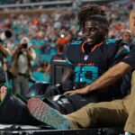 Miami Dolphins wide receiver Tyreek Hill (10) reacts after being placed on a medical cart against the New York Jets during the second half at Hard Rock Stadium.