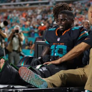 Miami Dolphins wide receiver Tyreek Hill (10) reacts after being placed on a medical cart against the New York Jets during the second half at Hard Rock Stadium.
