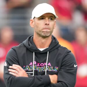 Arizona Cardinals head coach Jonathan Gannon stands on the field before their game against the Tennessee Titans at State Farm Stadium.