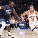New York Knicks guard Jalen Brunson (11) looks to drive past Minnesota Timberwolves forward Julius Randle (30) in the fourth quarter at Madison Square Garden.