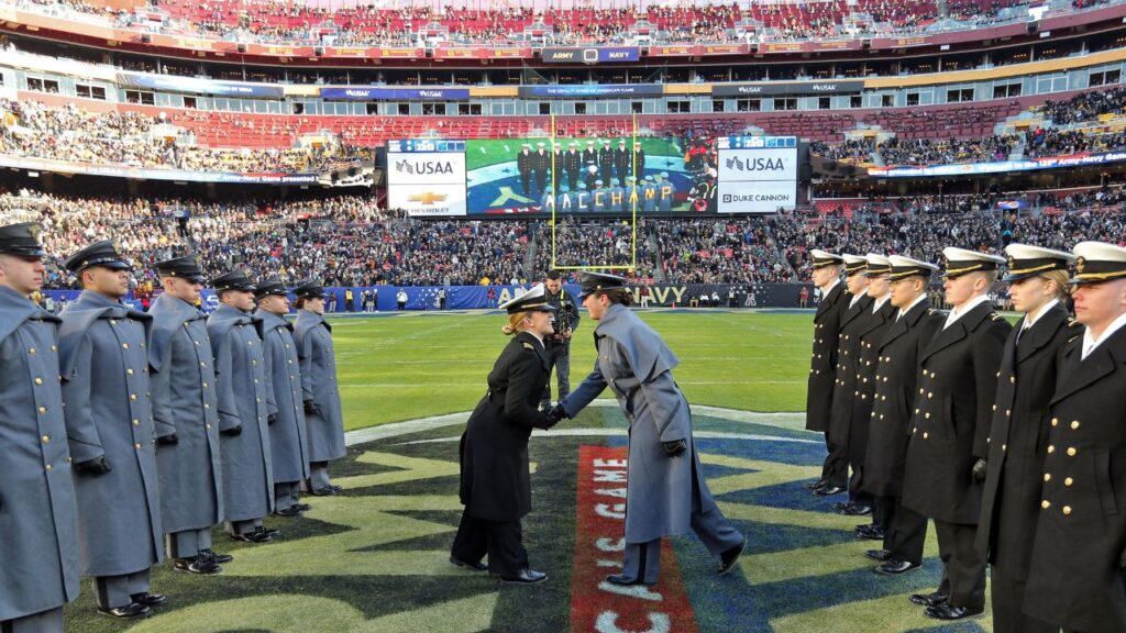 Cadets and Midshipmen participate in the prisoner exchange ceremony before the first half of the the 125th Army-Navy game at Northwest Stadium.
