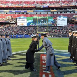 Cadets and Midshipmen participate in the prisoner exchange ceremony before the first half of the the 125th Army-Navy game at Northwest Stadium.