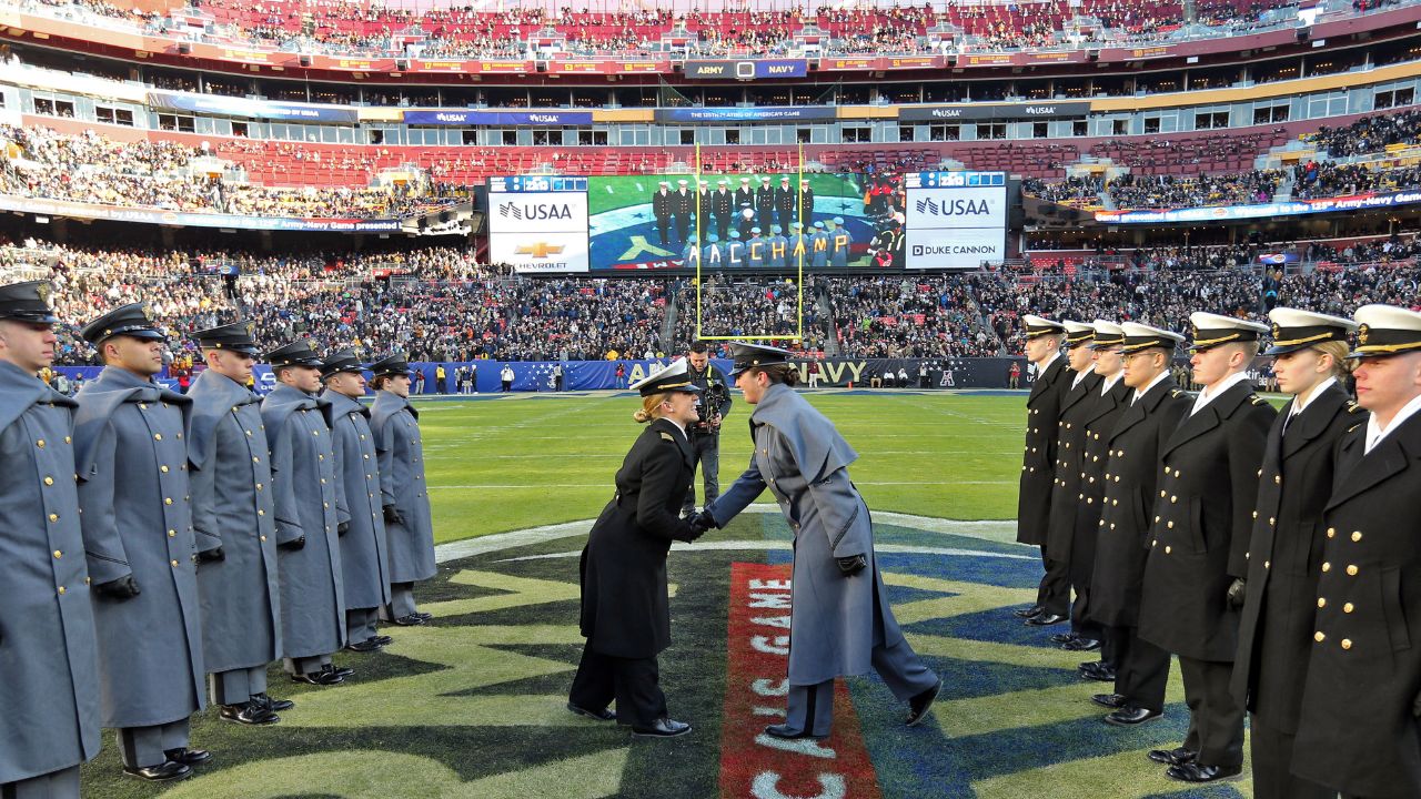 Cadets and Midshipmen participate in the prisoner exchange ceremony before the first half of the the 125th Army-Navy game at Northwest Stadium.