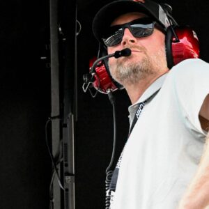 Dale Earnhardt Jr. looks out from his pit box Saturday, July 26, 2025, during the Pennzoil 250 at Indianapolis Motor Speedway