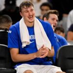 Dallas Mavericks forward Cooper Flagg (32) looks on from the team bench during the second half against the Oklahoma City Thunder at Dickie's Arena.