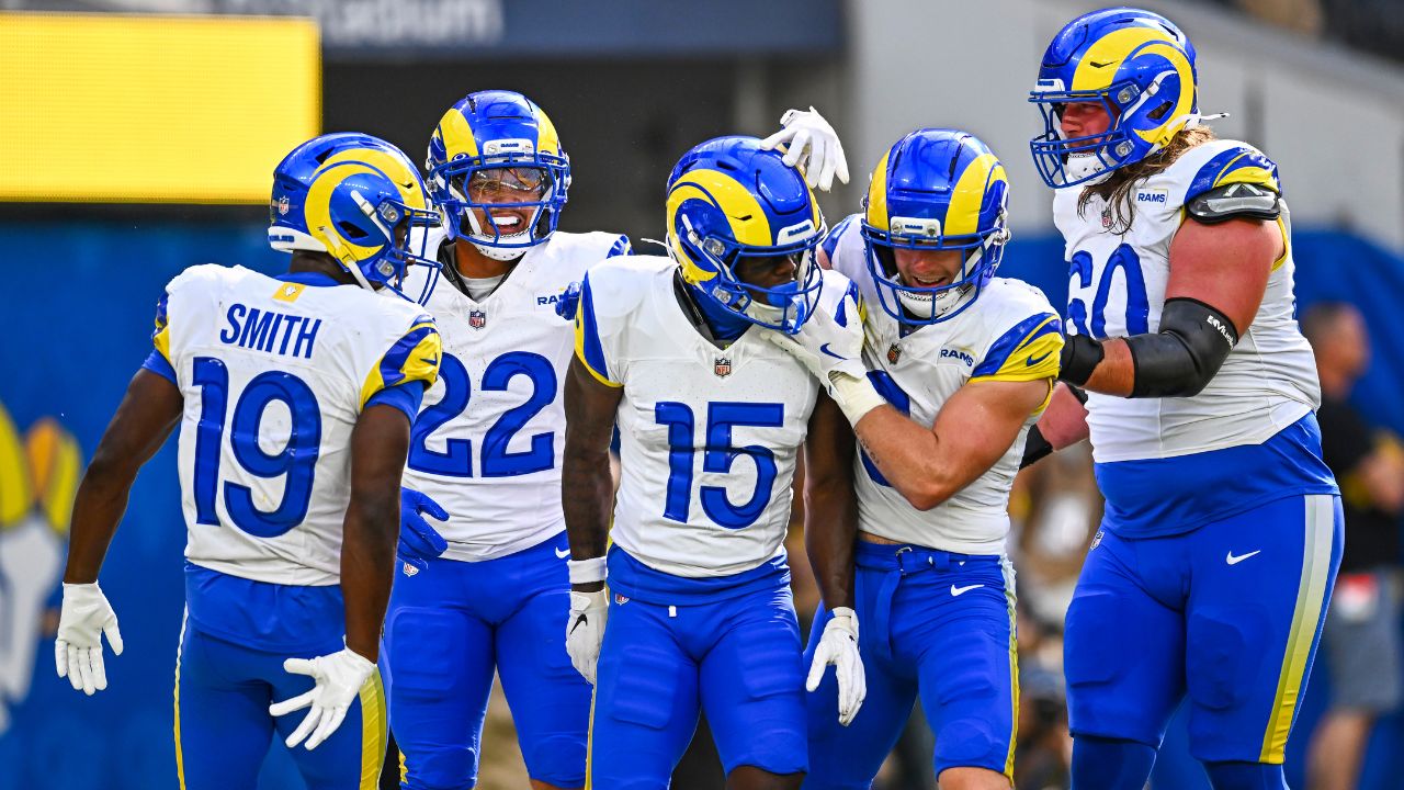Los Angeles Rams wide receiver Konata Mumpfield (15) celebrates a touchdown with linebacker Byron Young (0), running back Blake Corum (22), and wide receiver Xavier Smith (19) against the Los Angeles Chargers during the first quarter at SoFi Stadium.
