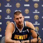 Sep 29, 2025; Denver, CO, USA; Denver Nuggets player Nikola Jokic (15) takes questions during media day at Ball Arena.