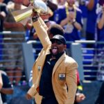 Baltimore Ravens former player Ray Lewis holds up the Lombardi trophy before the game between the Baltimore Ravens and the Cleveland Browns at M&T Bank Stadium.