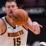 Oct 6, 2025; Vancouver, British Columbia, CAN; Denver Nuggets center Nikola Jokic (15) makes a pass against the Toronto Raptors in the second half at Rogers Arena
