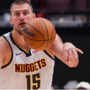 Oct 6, 2025; Vancouver, British Columbia, CAN; Denver Nuggets center Nikola Jokic (15) makes a pass against the Toronto Raptors in the second half at Rogers Arena