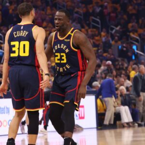 Apr 28, 2025; San Francisco, California, USA; Golden State Warriors forward Draymond Green (23) celebrated sight guard Stephen Curry (30) after a play against the Houston Rockets during the first quarter of game four of the 2025 NBA Playoffs first round at Chase Center