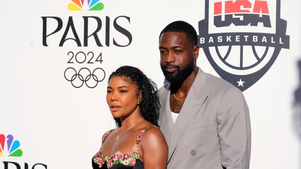 Aug 5, 2024; Paris, FRANCE; Dwyane Wade and wife Gabrielle Union pose for a photograph during the Paris 2024 Olympic Summer Games at Team USA House