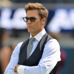 Tom Brady looks on before the game between the Los Angeles Chargers and the Washington Commanders at SoFi Stadium.